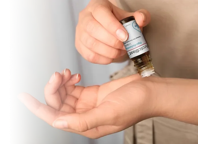 Person applying Arctic Blast topical liquid to the wrist